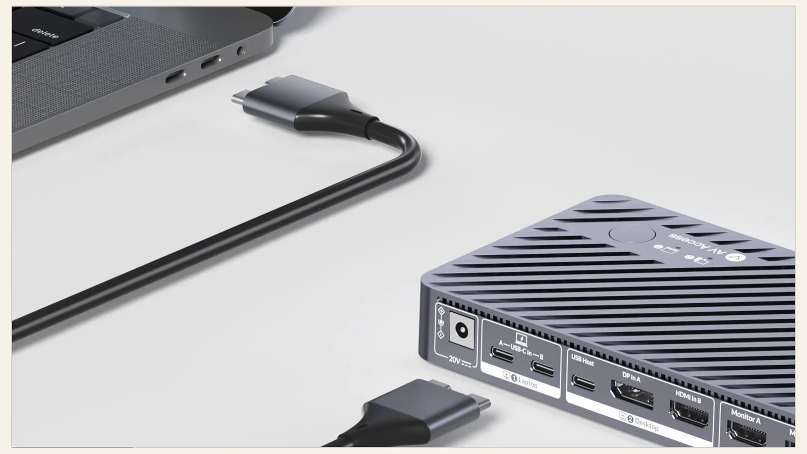 AV Access iDock M10 connected to a MacBook with its KVM ports visible
