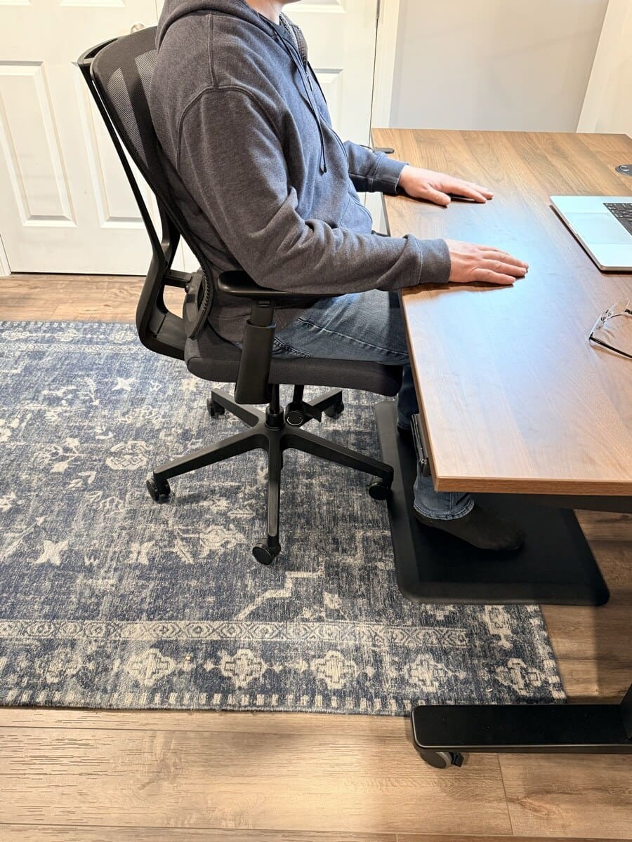 Sitting in the Clarksville at the UPLIFT V3 Standing Desk during a work session