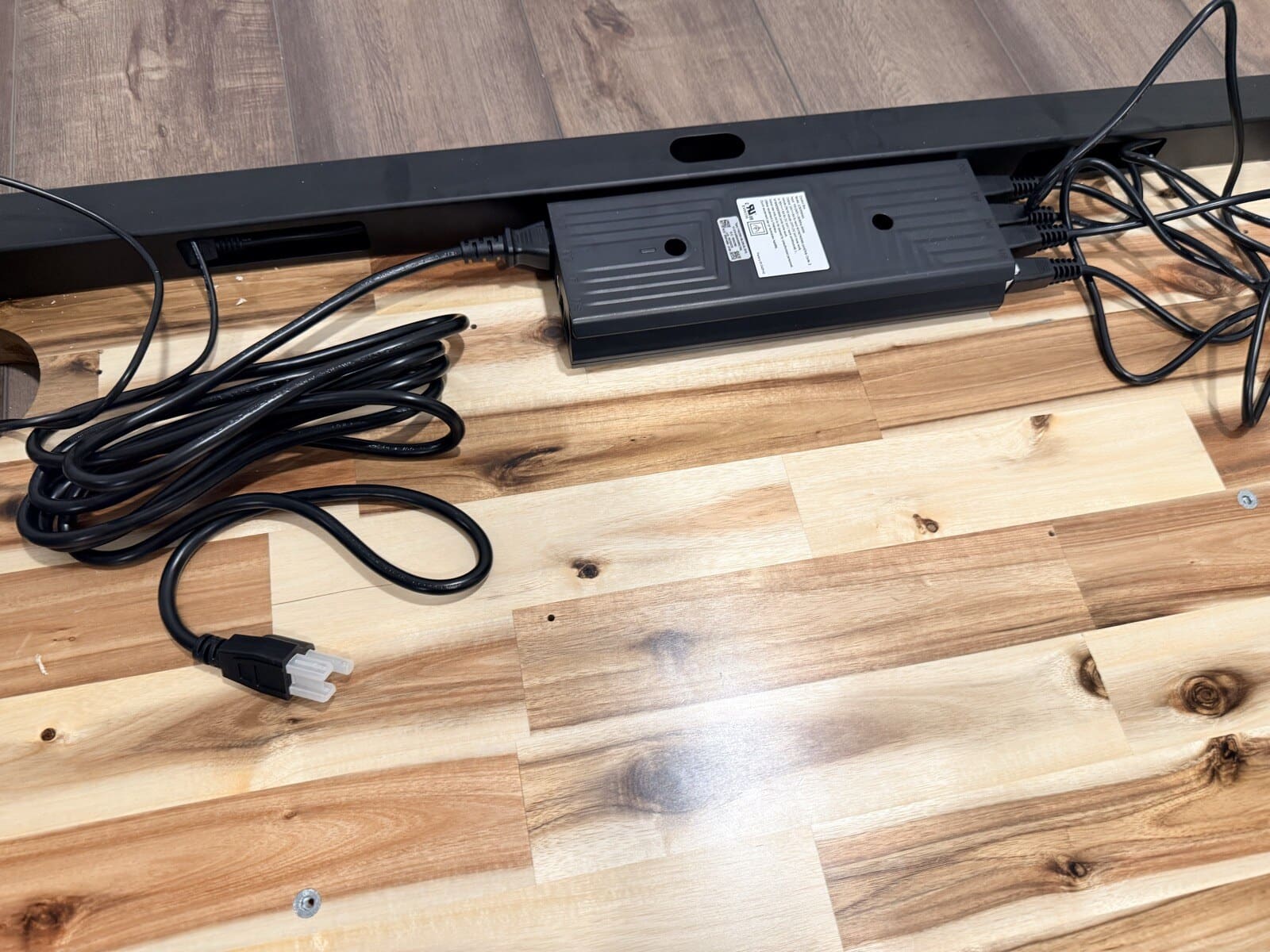 Power supply and control box mounted to the frame crossbar
