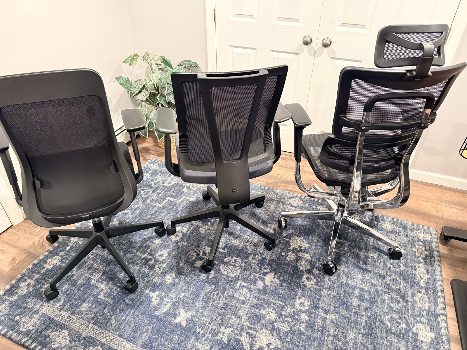 Three UPLIFT chairs lined up for comparison