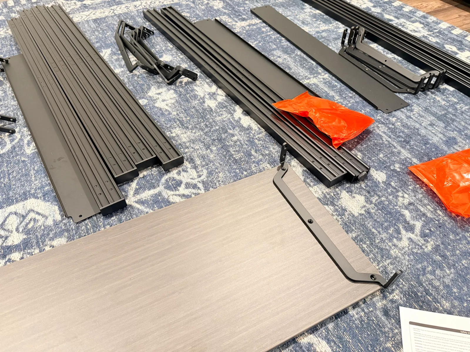 All the UPLIFT Sequence Shelves parts laid out on the floor before assembly