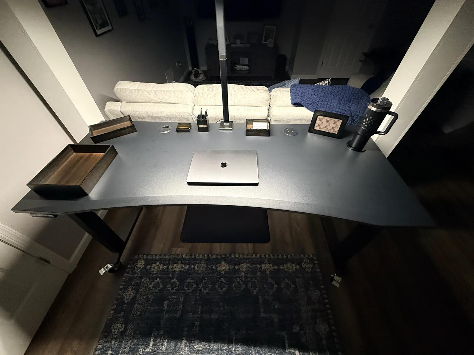 Black Eco Curve desktop on an assembled UPLIFT V3 4-Leg desk