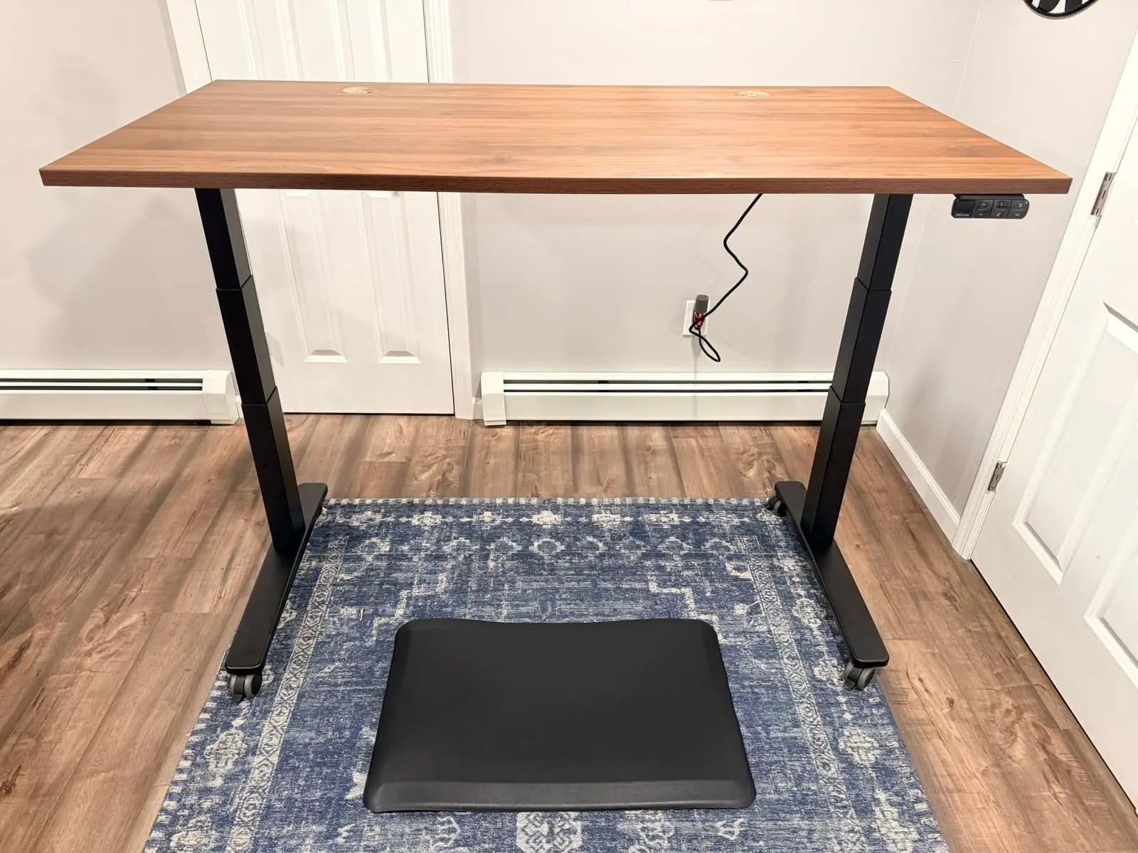 UPLIFT V3 Standing Desk at standing height with walnut desktop
