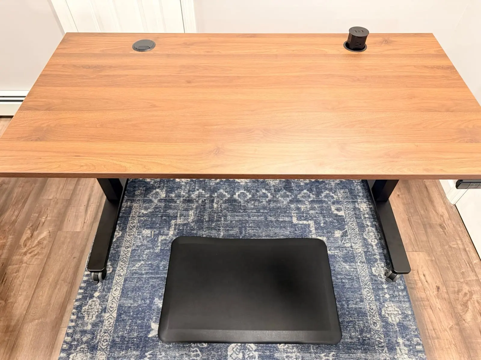 UPLIFT V3 desktop with walnut surface and pop-up grommet