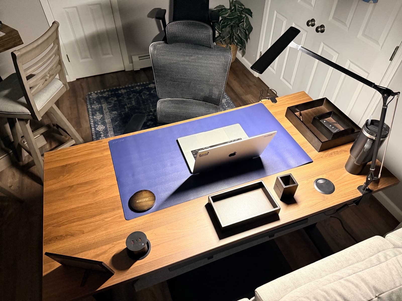 UPLIFT V3 standing desk in a home office — the workstation we've lived with