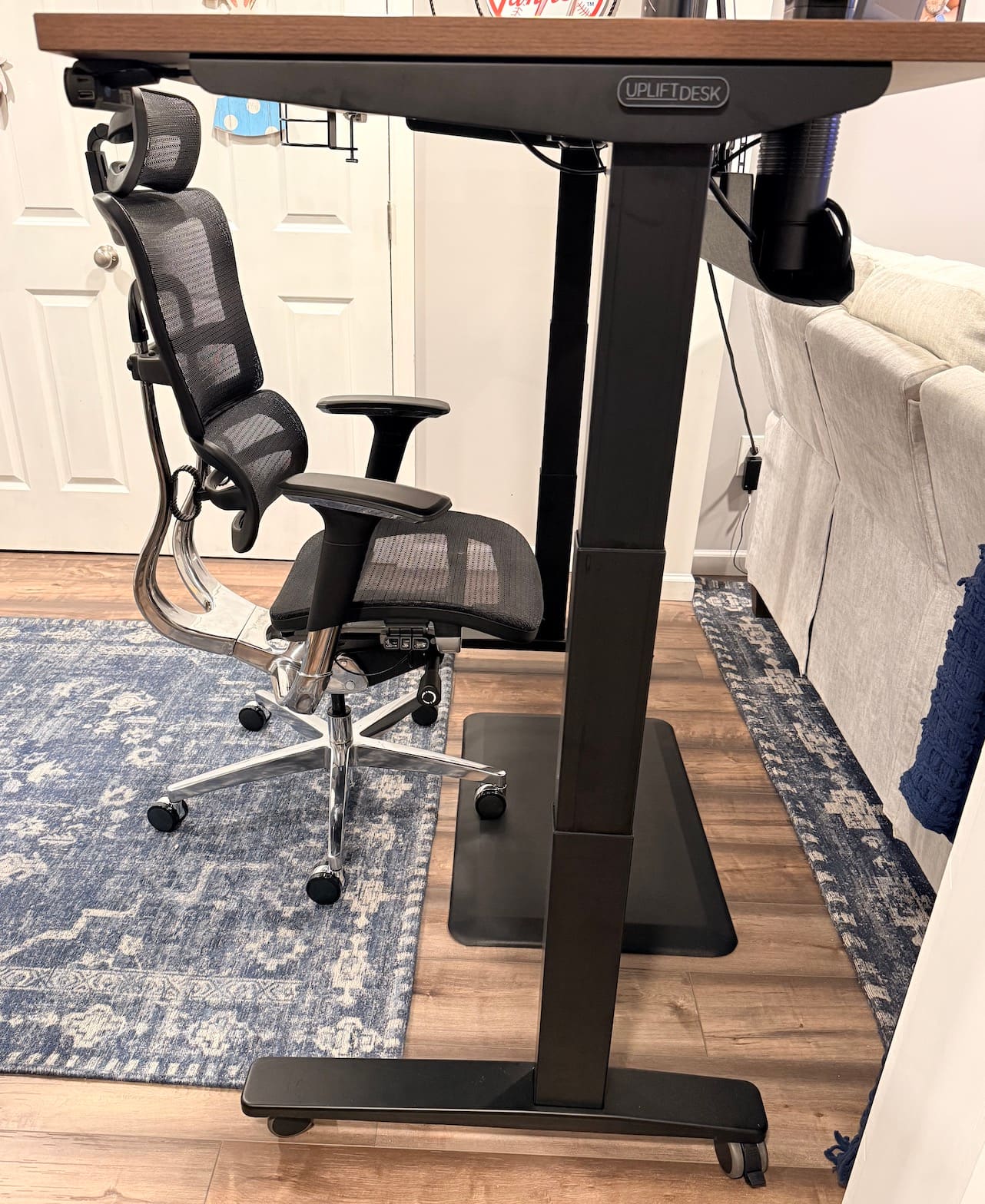 Wide shot of UPLIFT V3 desk setup in room at standing height