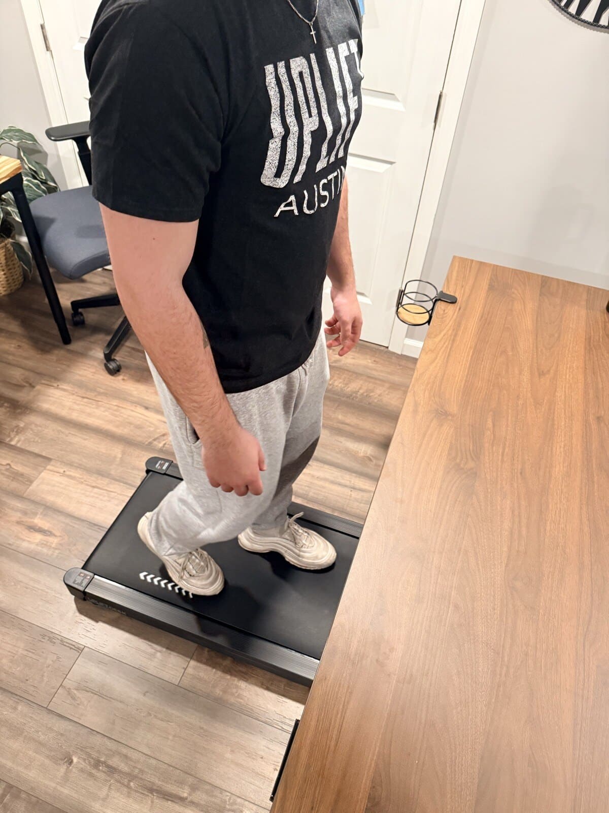 Walking on the UPLIFT pad at the V3 desk during a work session